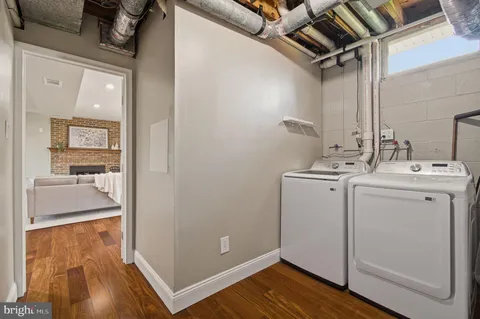 a utility room with closet dryer and washer