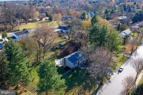 an aerial view of a house with a lake view