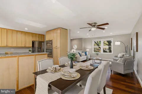 a view of a dining room with furniture and wooden floor