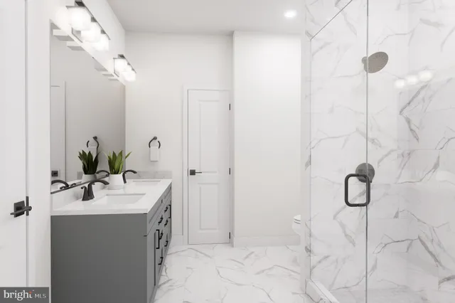 a bed room with a bed and a chandelier