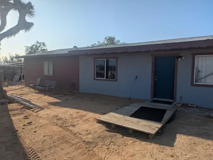 a view of a backyard of a house