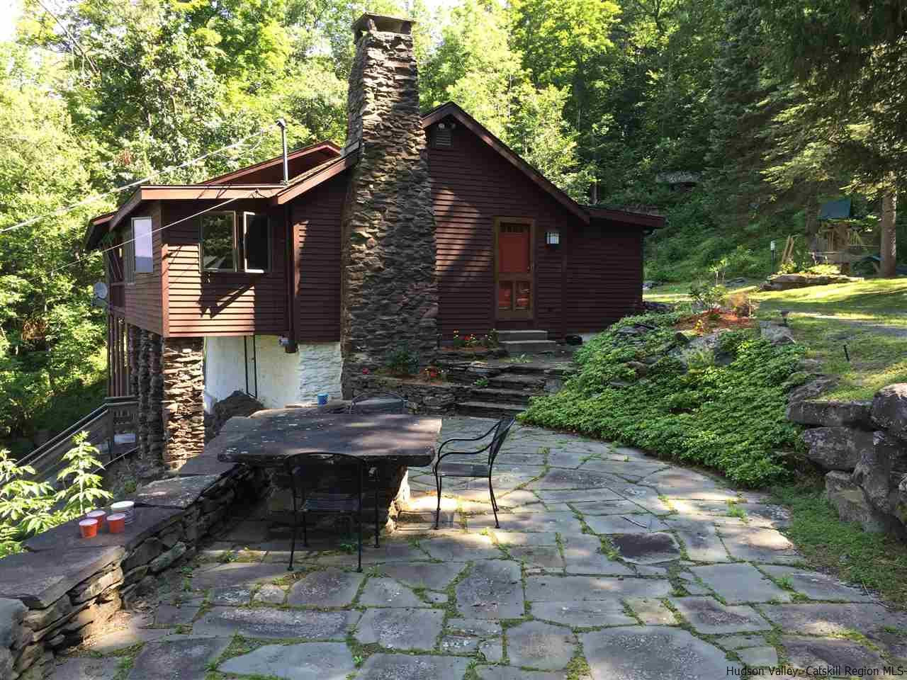 2727 Vega Mountain Road Roxbury, NY 12421 - Photo 1 of 31 a front view of a house with garden