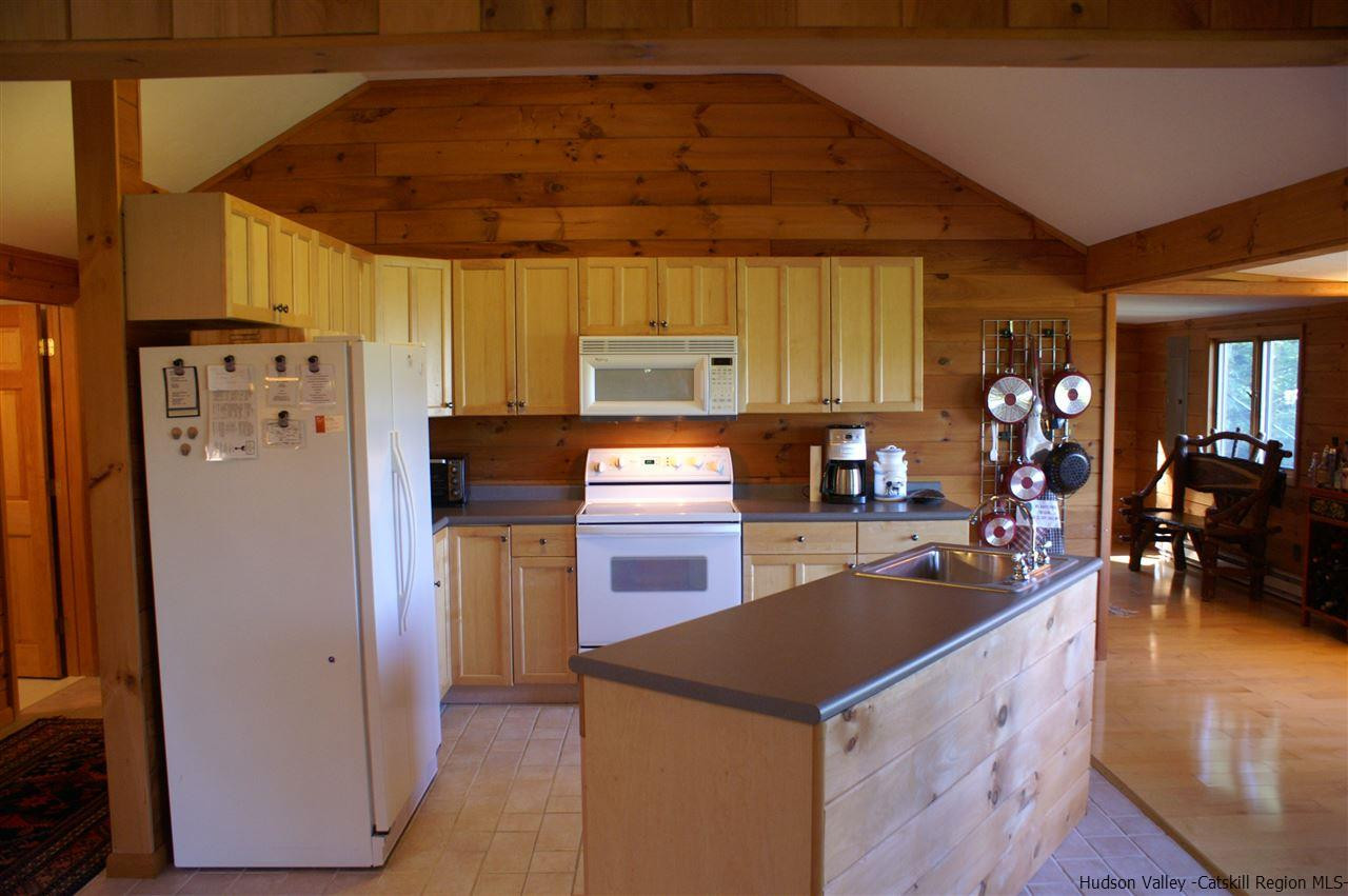2727 Vega Mountain Road Roxbury, NY 12421 - Photo 15 of 31 a kitchen with a refrigerator and a stove