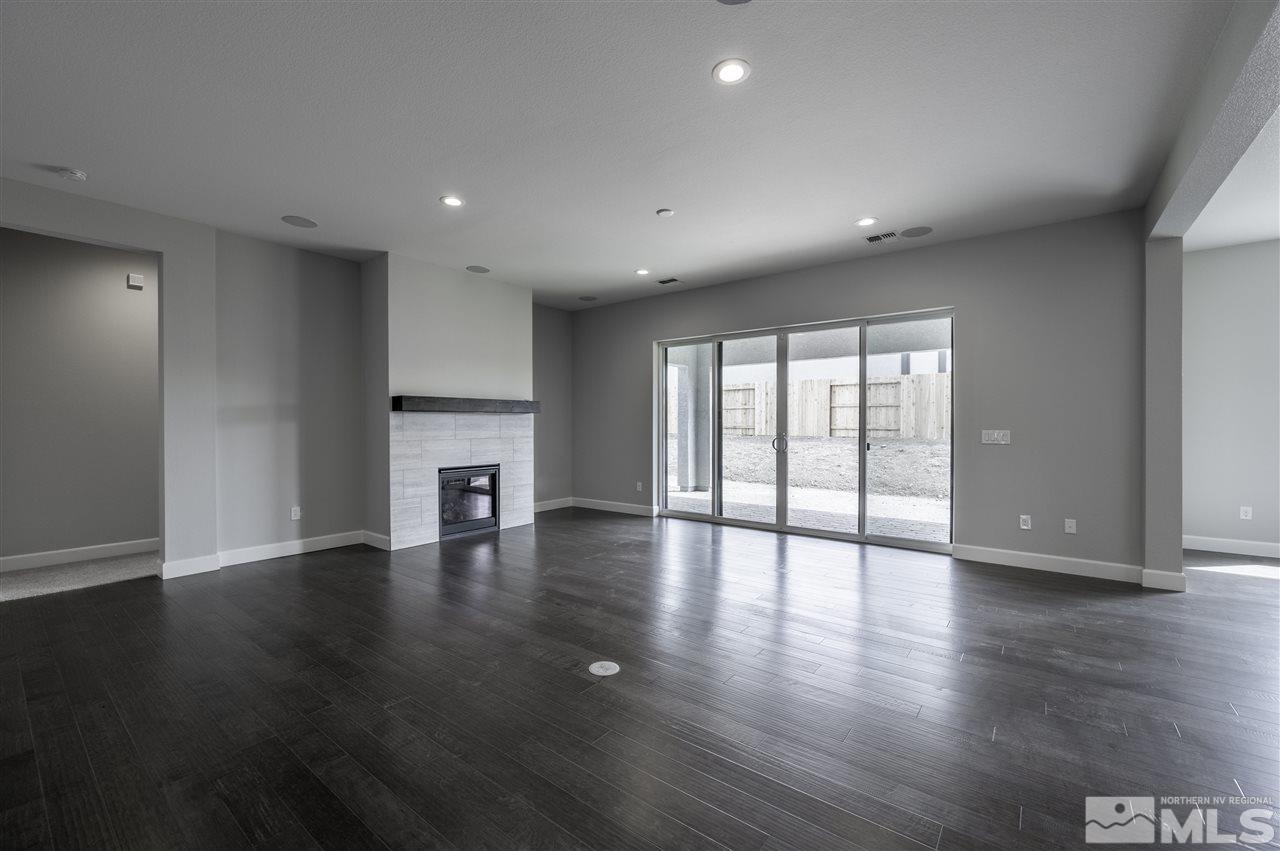 2516 Titanium Crest Drive, Unit HOMESITE 36 Reno, NV 89521 - Photo 3 of 19 a view of an empty room with wooden floor and a window