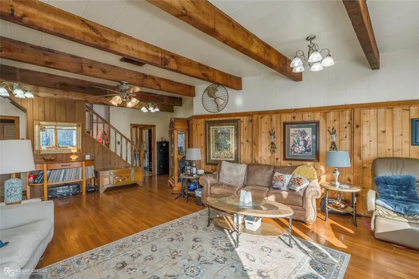 a view of a hallway with entryway wooden floor and front door