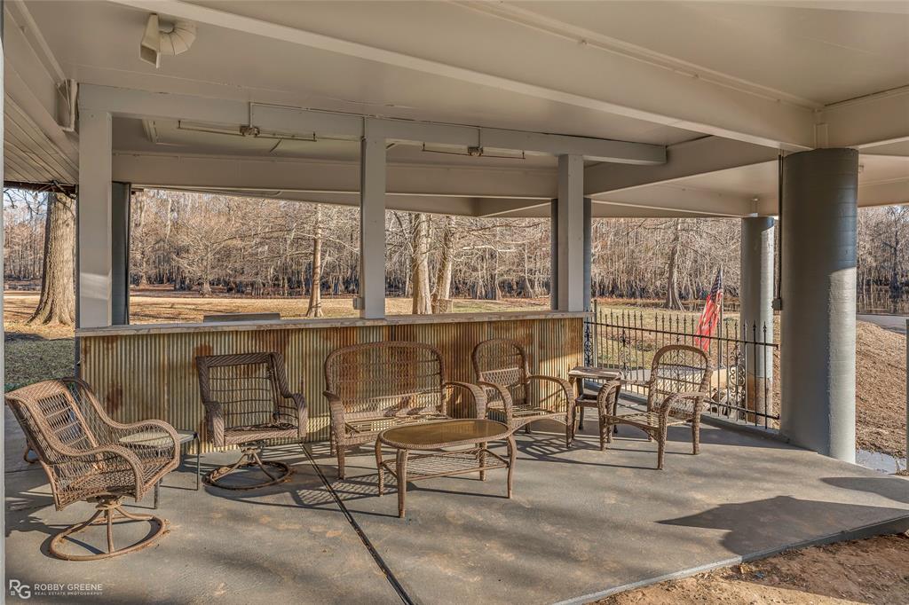 350 Brushy Creek Road Sibley, LA 71073 - Photo 13 of 40 a living room with patio furniture and a large window