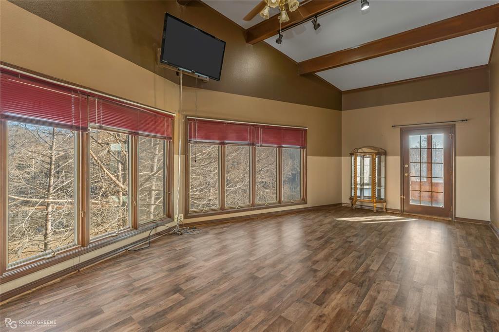 350 Brushy Creek Road Sibley, LA 71073 - Photo 16 of 40 a view of an empty room with wooden floor and a window