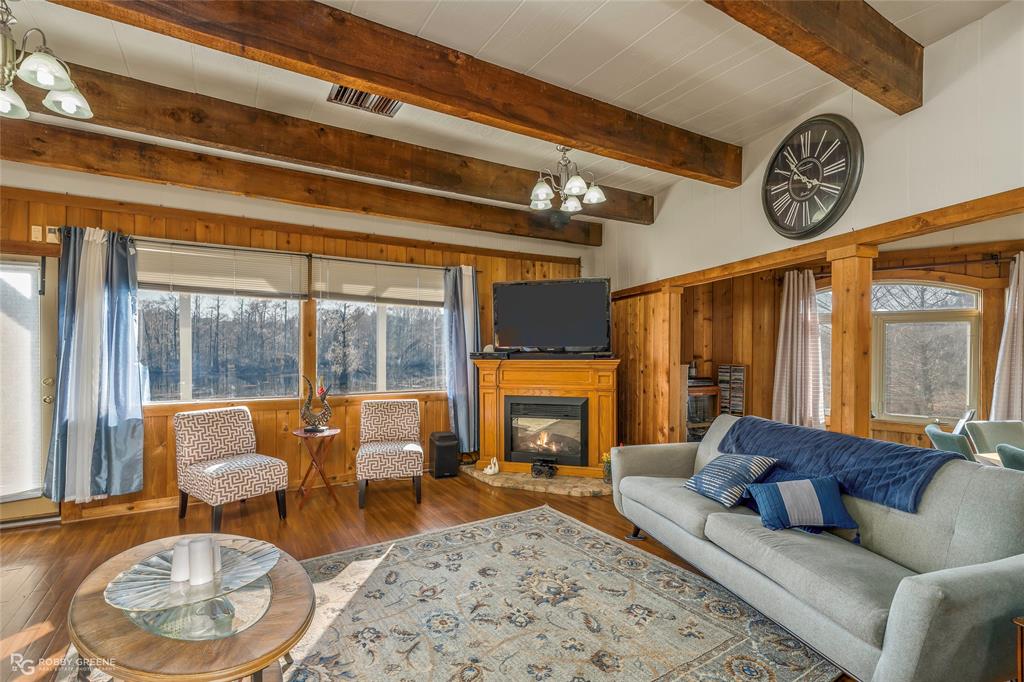 350 Brushy Creek Road Sibley, LA 71073 - Photo 20 of 40 a living room with furniture and a fireplace