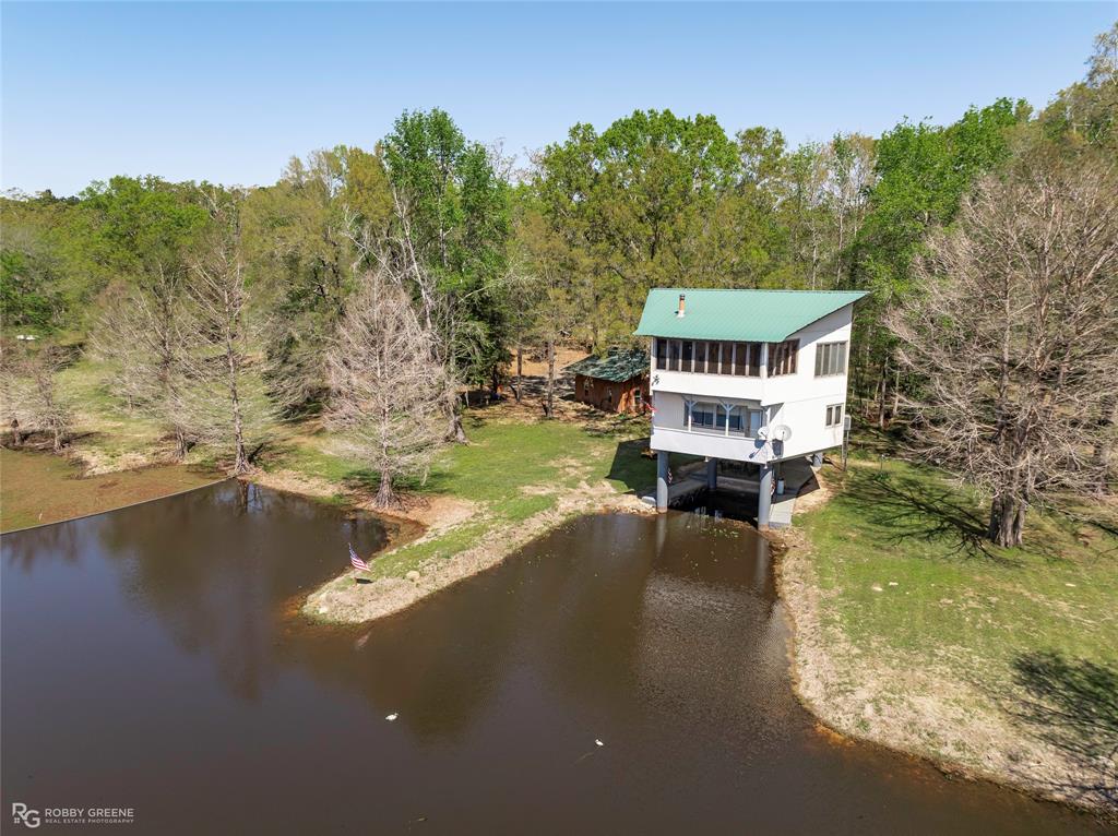 350 Brushy Creek Road Sibley, LA 71073 - Photo 2 of 40 a view of a lake with a mountain in the background