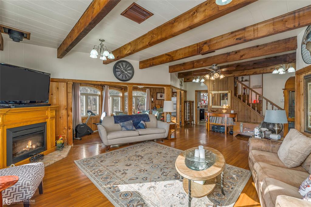 350 Brushy Creek Road Sibley, LA 71073 - Photo 21 of 40 a living room with fireplace furniture and a flat screen tv