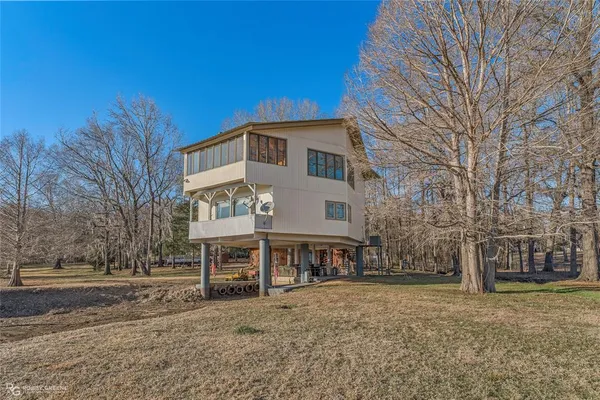 a view of a kitchen with kitchen island a large window in it