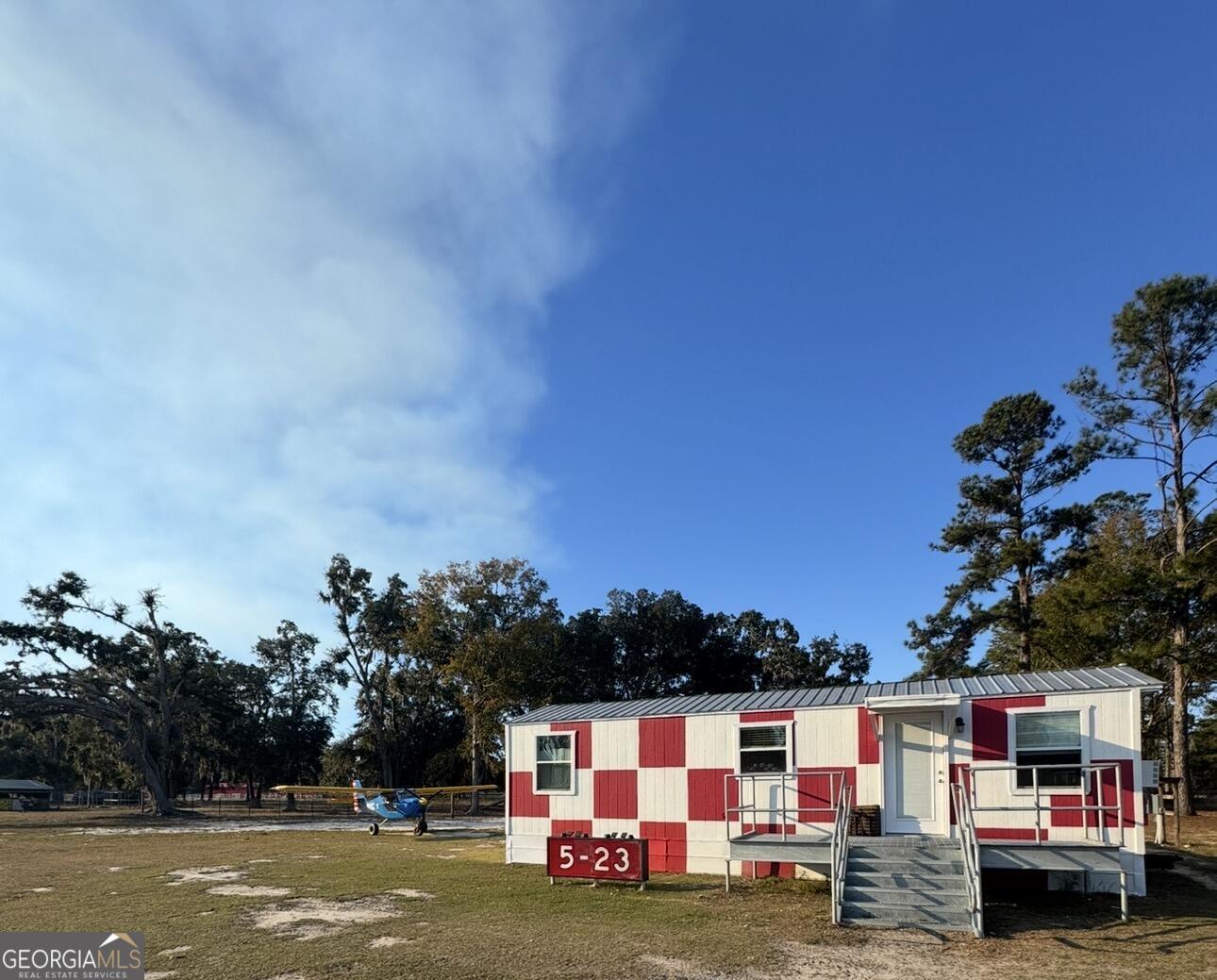 3932 Wilkerson Road Valdosta, GA 31606 - Photo 11 of 12 a view of house with outdoor space and seating area