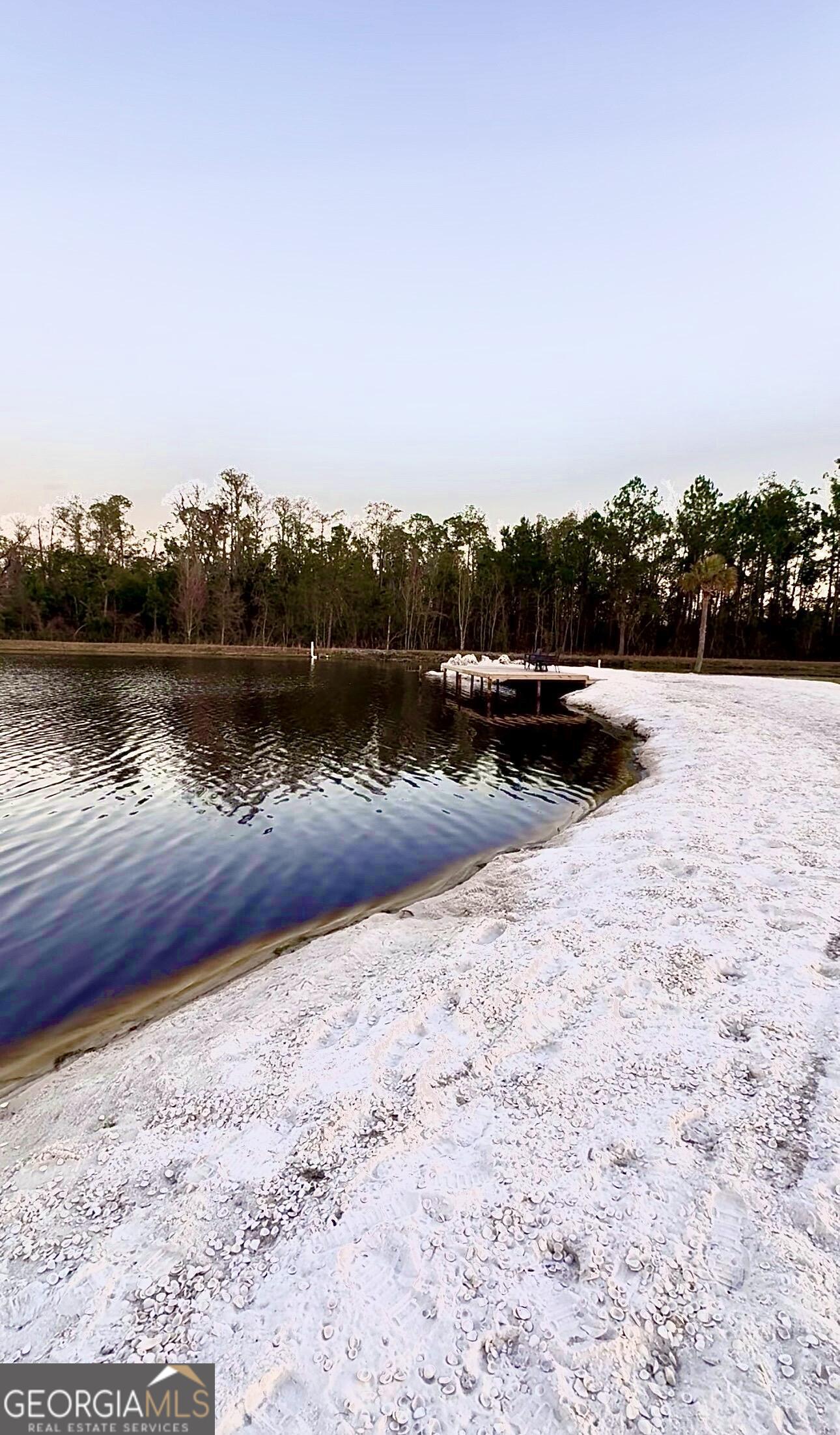 3932 Wilkerson Road Valdosta, GA 31606 - Photo 2 of 12 a view of a lake with mountain in the background