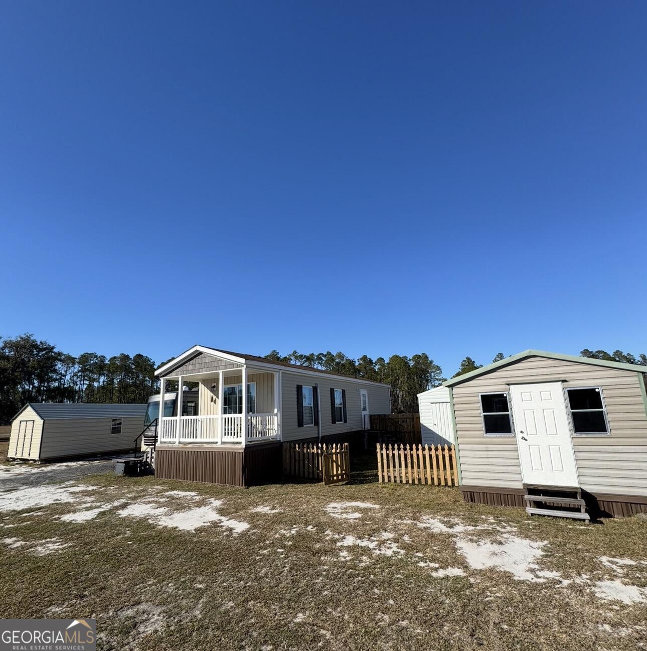 3932 Wilkerson Road Valdosta, GA 31606 - Photo 8 of 12 a front view of a house with a yard