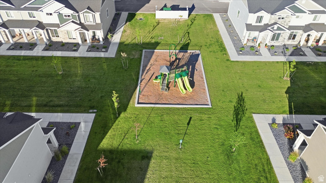 2257 South 1090 West, Unit 74 Nibley, UT 84321 - Photo 37 of 40 Community green space featuring a central playground with slides and swings