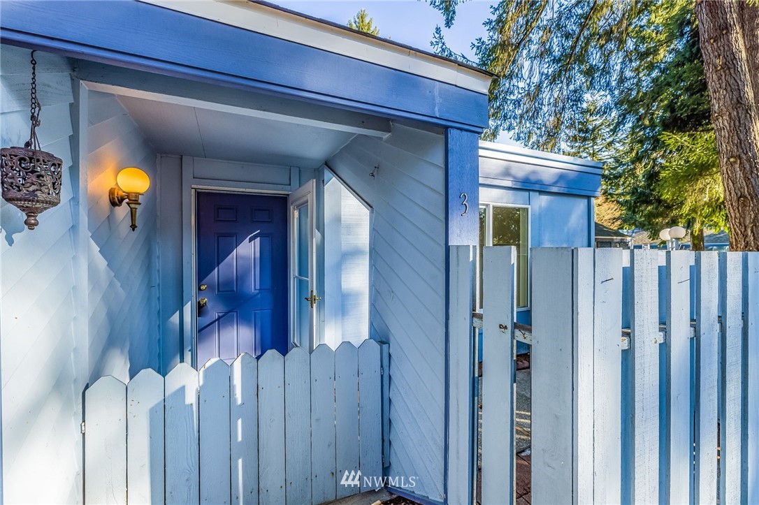 4308 Northeast Sunset Boulevard, Unit F3 Renton, WA 98059 - Photo 1 of 26 a view of a house with wooden fence