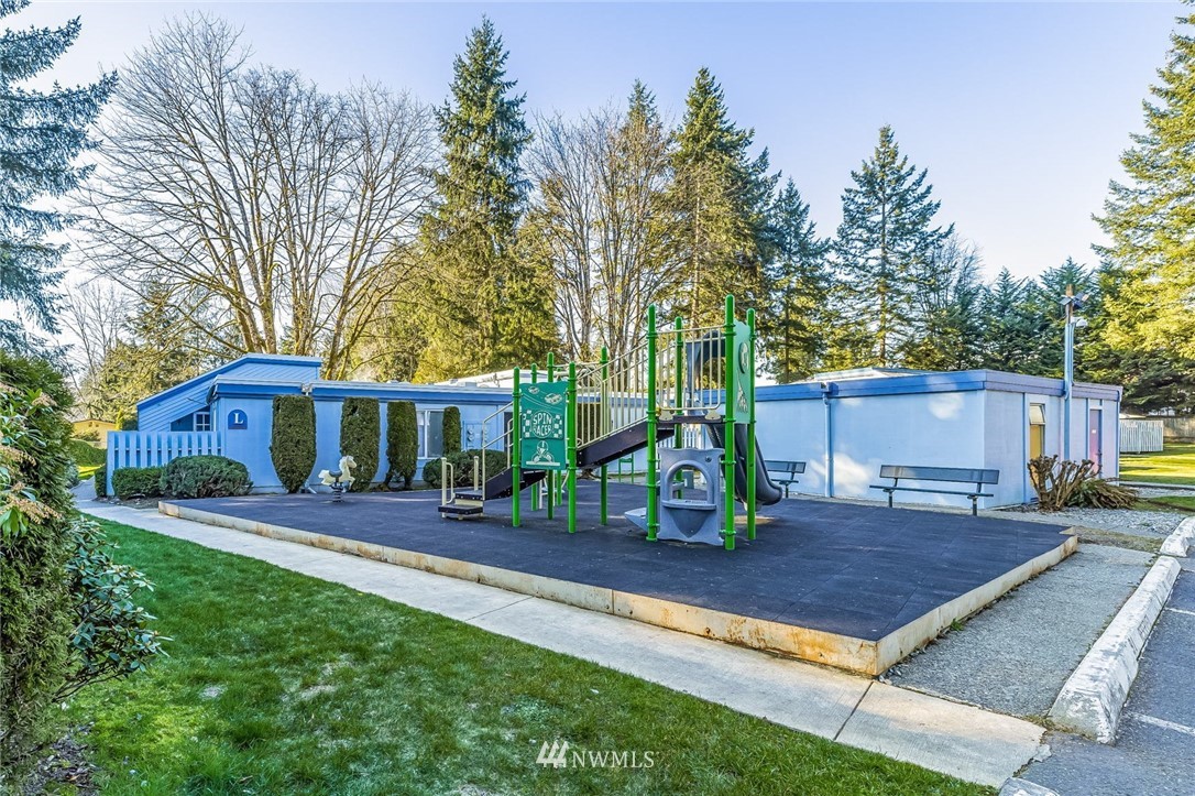 4308 Northeast Sunset Boulevard, Unit F3 Renton, WA 98059 - Photo 22 of 26 a view of a house with a yard