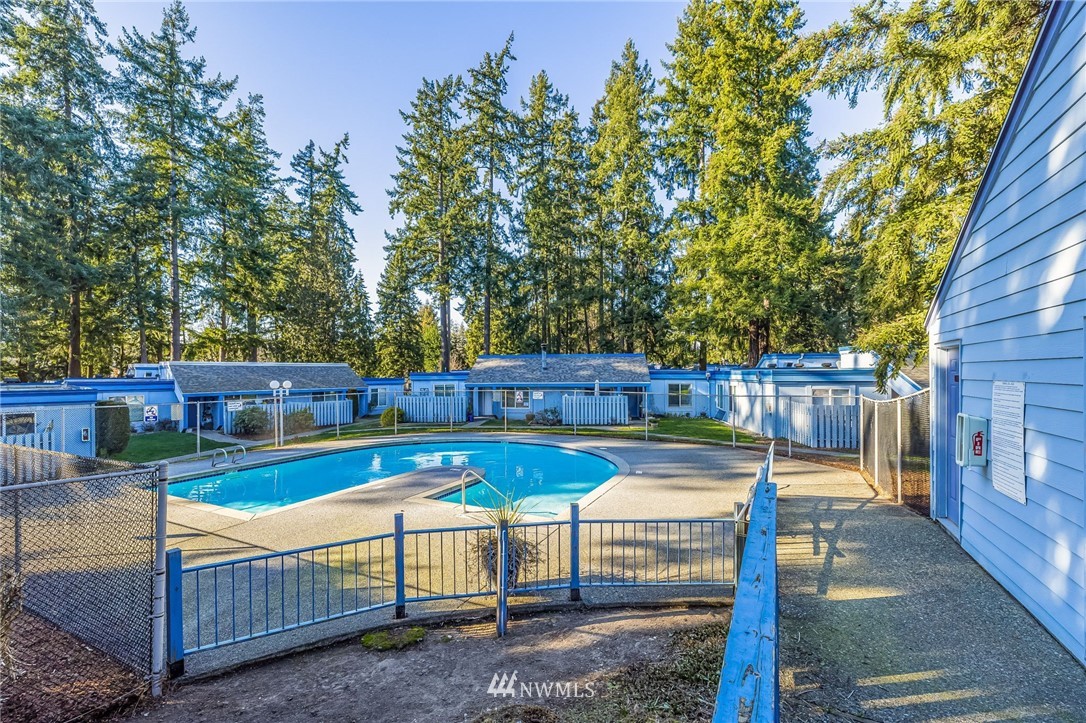 4308 Northeast Sunset Boulevard, Unit F3 Renton, WA 98059 - Photo 23 of 26 a view of a backyard with swimming pool