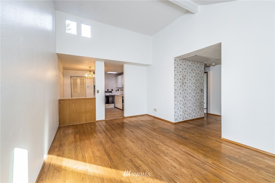 4308 Northeast Sunset Boulevard, Unit F3 Renton, WA 98059 - Photo 5 of 26 a view of a livingroom with wooden floor