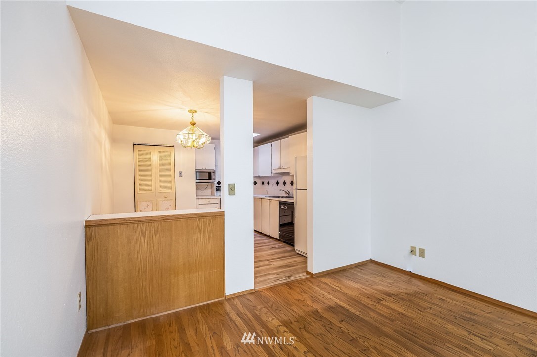 4308 Northeast Sunset Boulevard, Unit F3 Renton, WA 98059 - Photo 6 of 26 a view of a kitchen cabinets and wooden floor