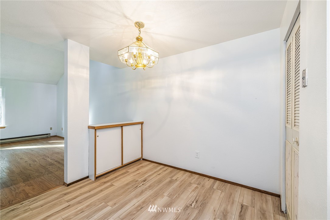 4308 Northeast Sunset Boulevard, Unit F3 Renton, WA 98059 - Photo 10 of 26 a view of an empty room with wooden floor