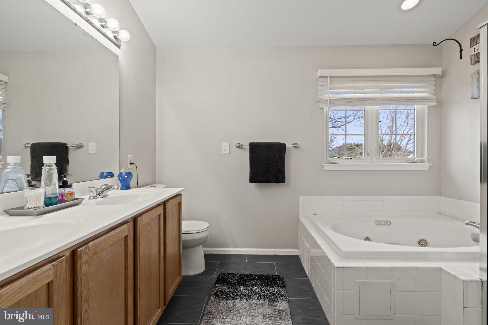 5 Panama Court Carneys Point, NJ 08069 - Photo 26 of 36 a bathroom with a tub sink and mirror