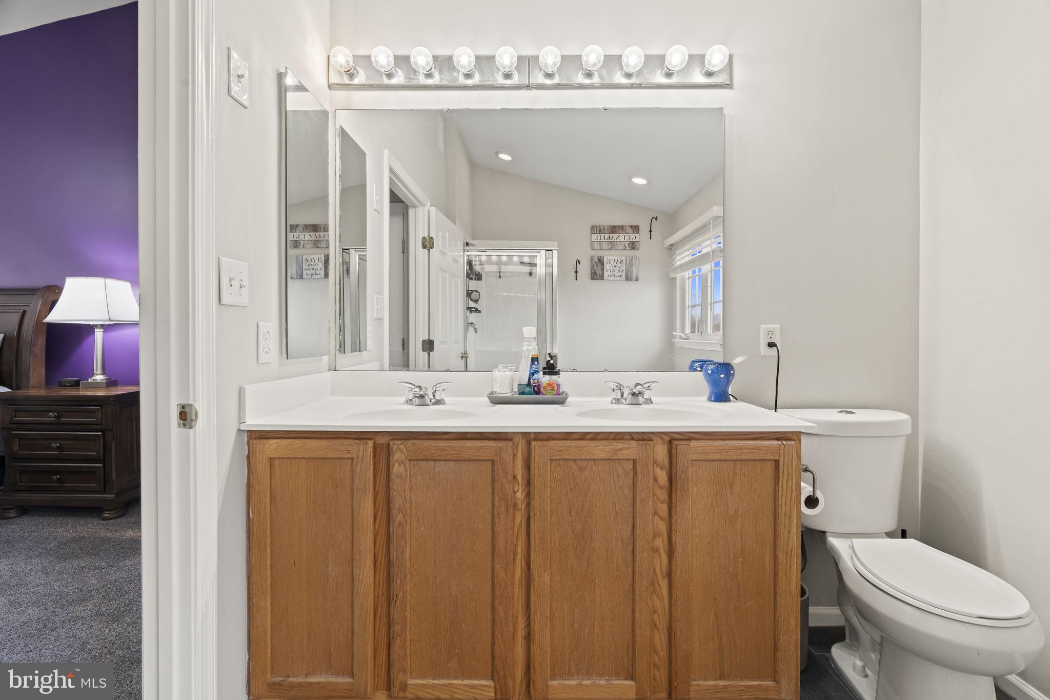 5 Panama Court Carneys Point, NJ 08069 - Photo 29 of 36 a bathroom with a granite countertop toilet sink and mirror