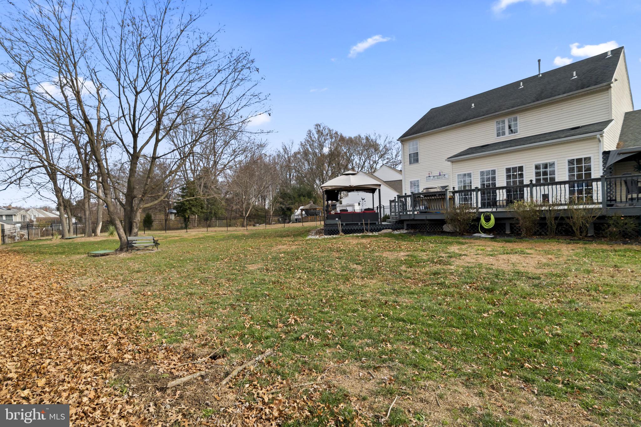 5 Panama Court Carneys Point, NJ 08069 - Photo 35 of 36 a car parked in front of a house with a yard