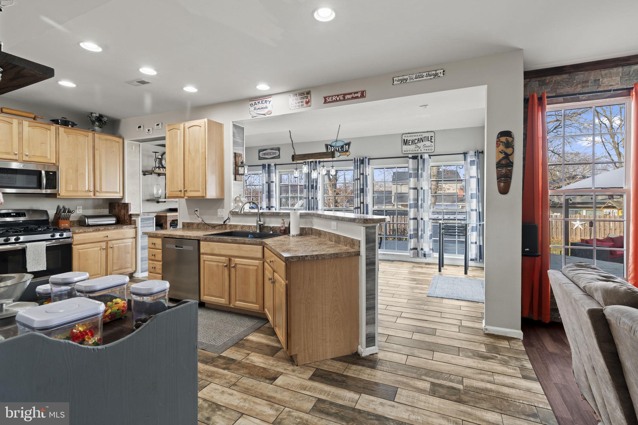 5 Panama Court Carneys Point, NJ 08069 - Photo 9 of 36 a kitchen with stainless steel appliances granite countertop a stove top oven a sink and a refrigerator