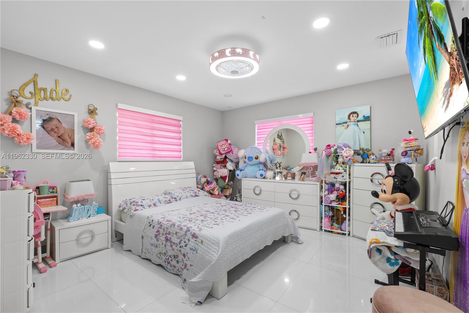 33300 Southwest 212th Avenue Homestead, FL 33034 - Photo 17 of 60 a bedroom with a bed and a window