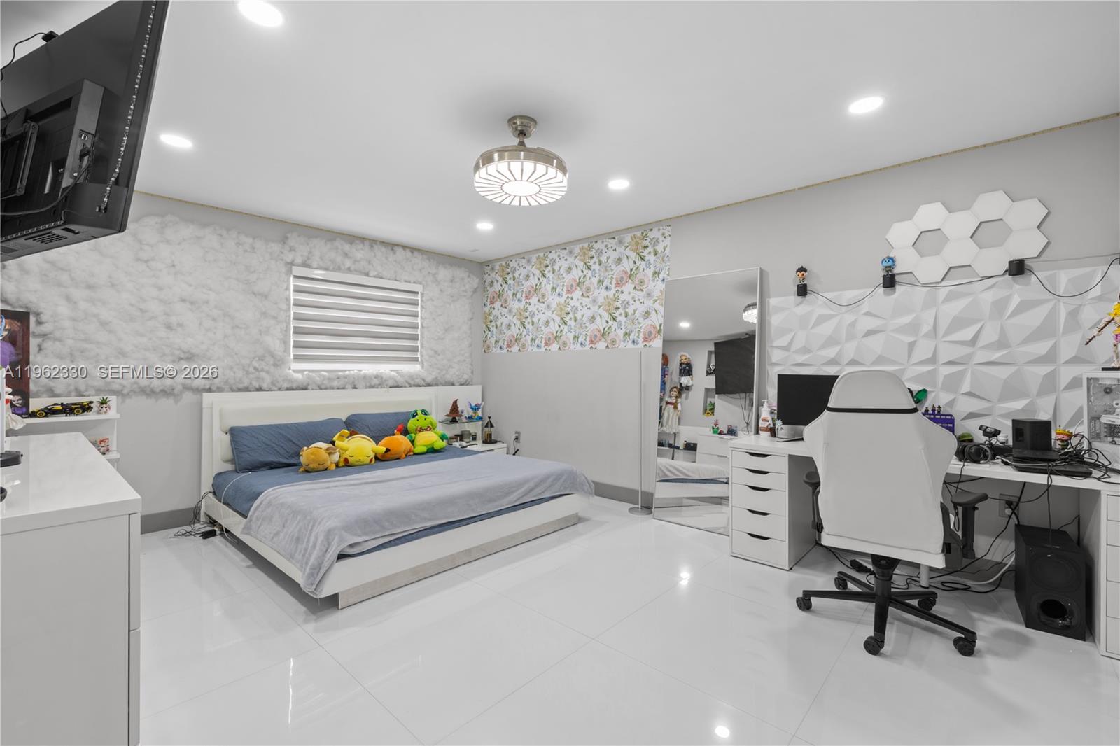 33300 Southwest 212th Avenue Homestead, FL 33034 - Photo 18 of 60 a living room with furniture and a flat screen tv