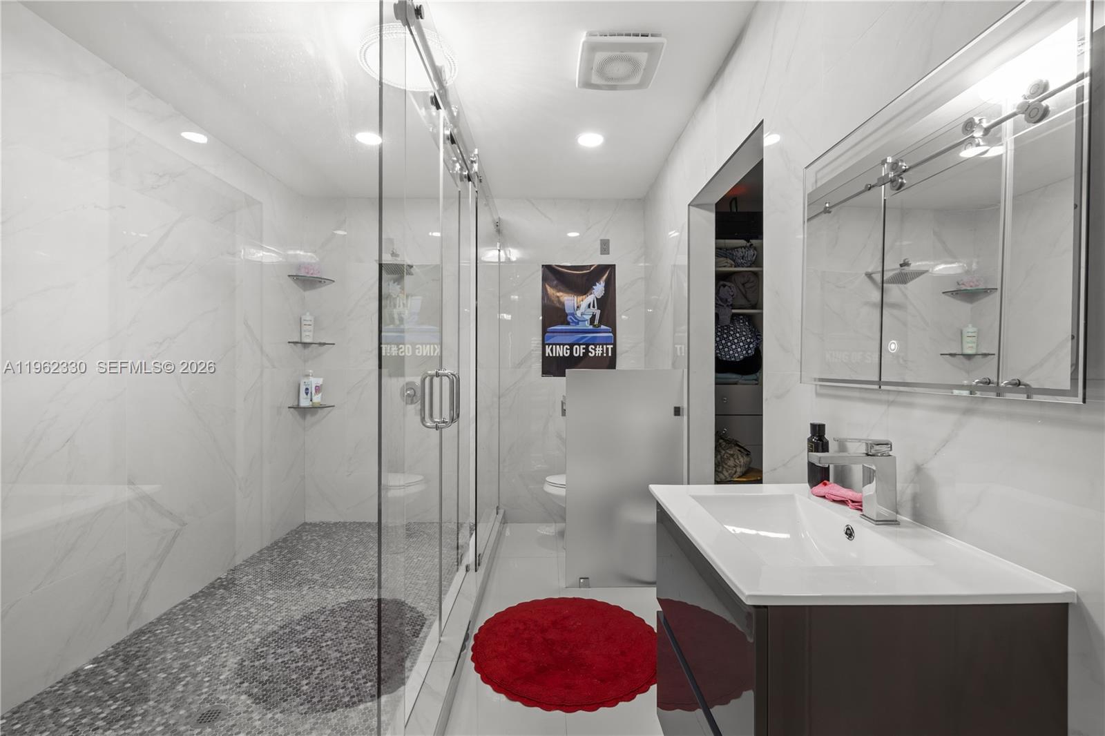 33300 Southwest 212th Avenue Homestead, FL 33034 - Photo 19 of 60 a spacious bathroom with a sink a toilet and shower