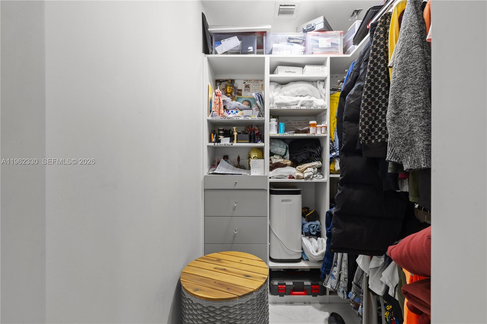33300 Southwest 212th Avenue Homestead, FL 33034 - Photo 27 of 60 a view of walk in closet with clothes and shoes