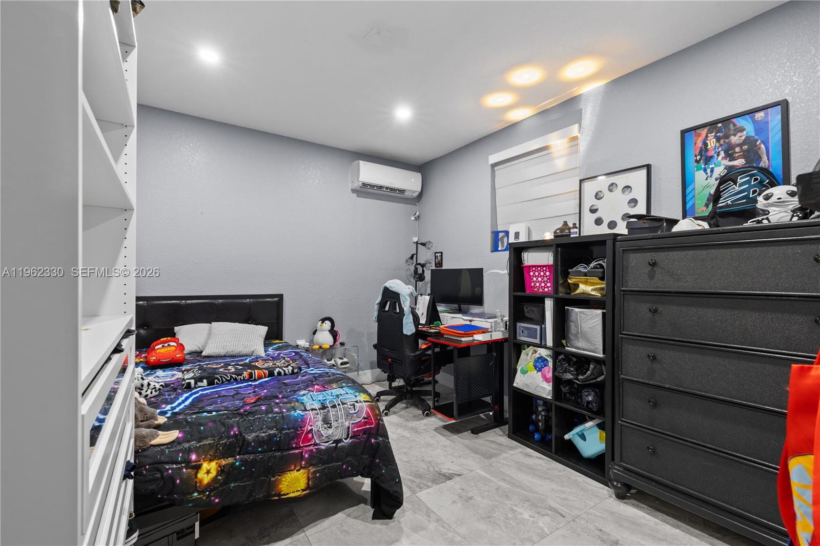 33300 Southwest 212th Avenue Homestead, FL 33034 - Photo 32 of 60 a bedroom with a bed and a tv