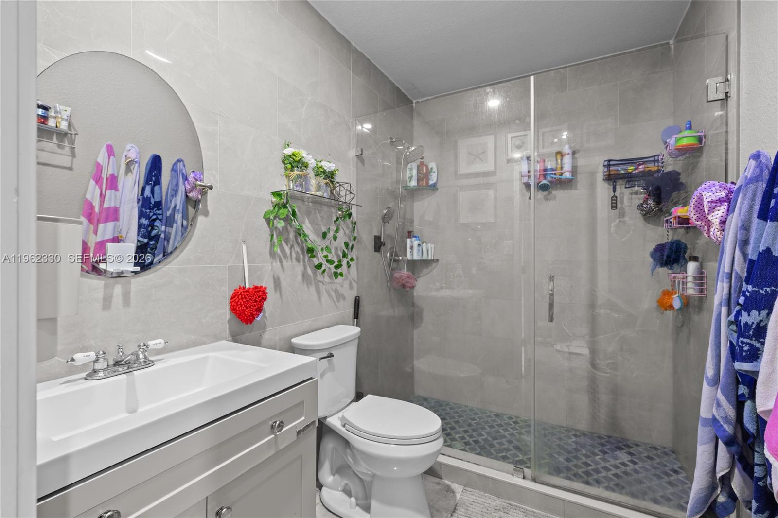 33300 Southwest 212th Avenue Homestead, FL 33034 - Photo 33 of 60 a bathroom with a sink toilet and shower