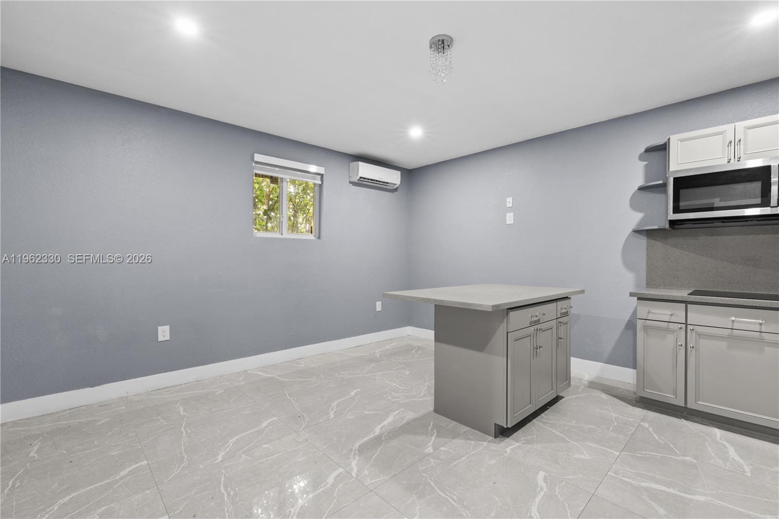 33300 Southwest 212th Avenue Homestead, FL 33034 - Photo 40 of 60 a kitchen with stainless steel appliances granite countertop a stove and a sink