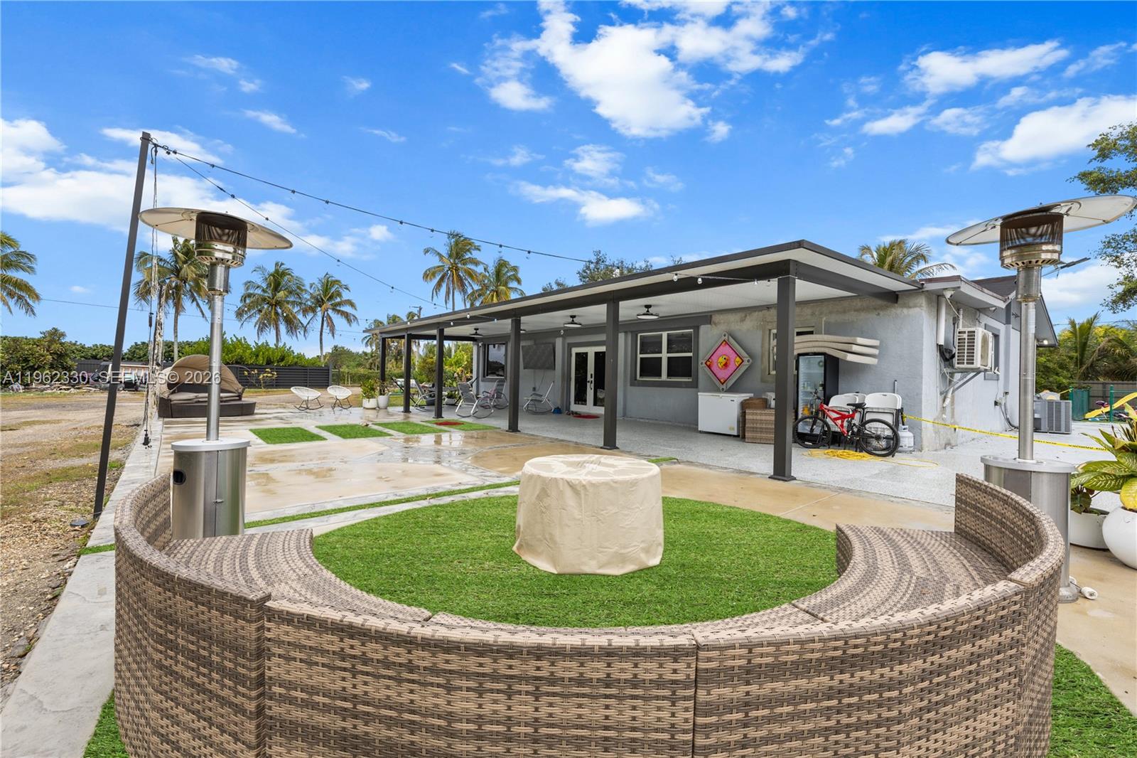 33300 Southwest 212th Avenue Homestead, FL 33034 - Photo 4 of 60 a view of a house with backyard and sitting area