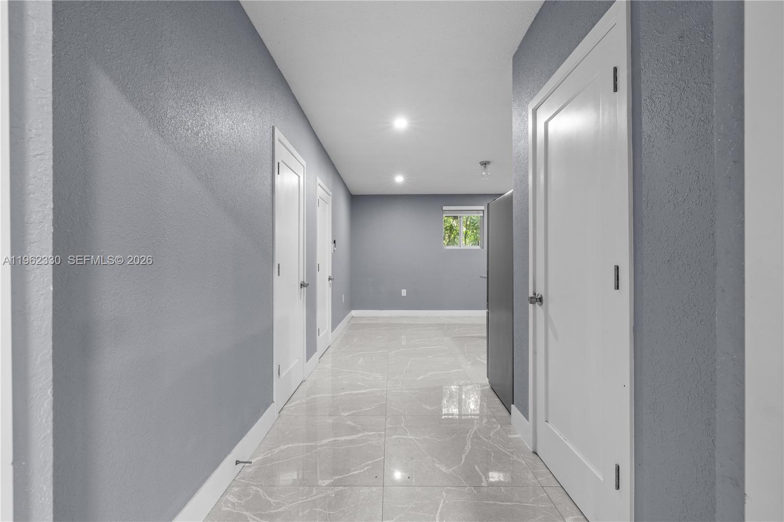 33300 Southwest 212th Avenue Homestead, FL 33034 - Photo 49 of 60 a view of a hallway