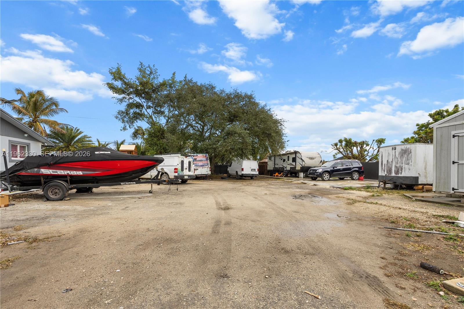 33300 Southwest 212th Avenue Homestead, FL 33034 - Photo 52 of 60 a view of a street with cars