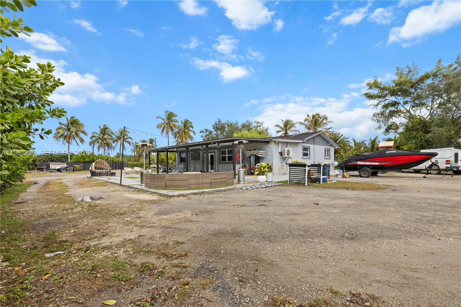 33300 Southwest 212th Avenue Homestead, FL 33034 - Photo 54 of 60 a view of street with parked cars