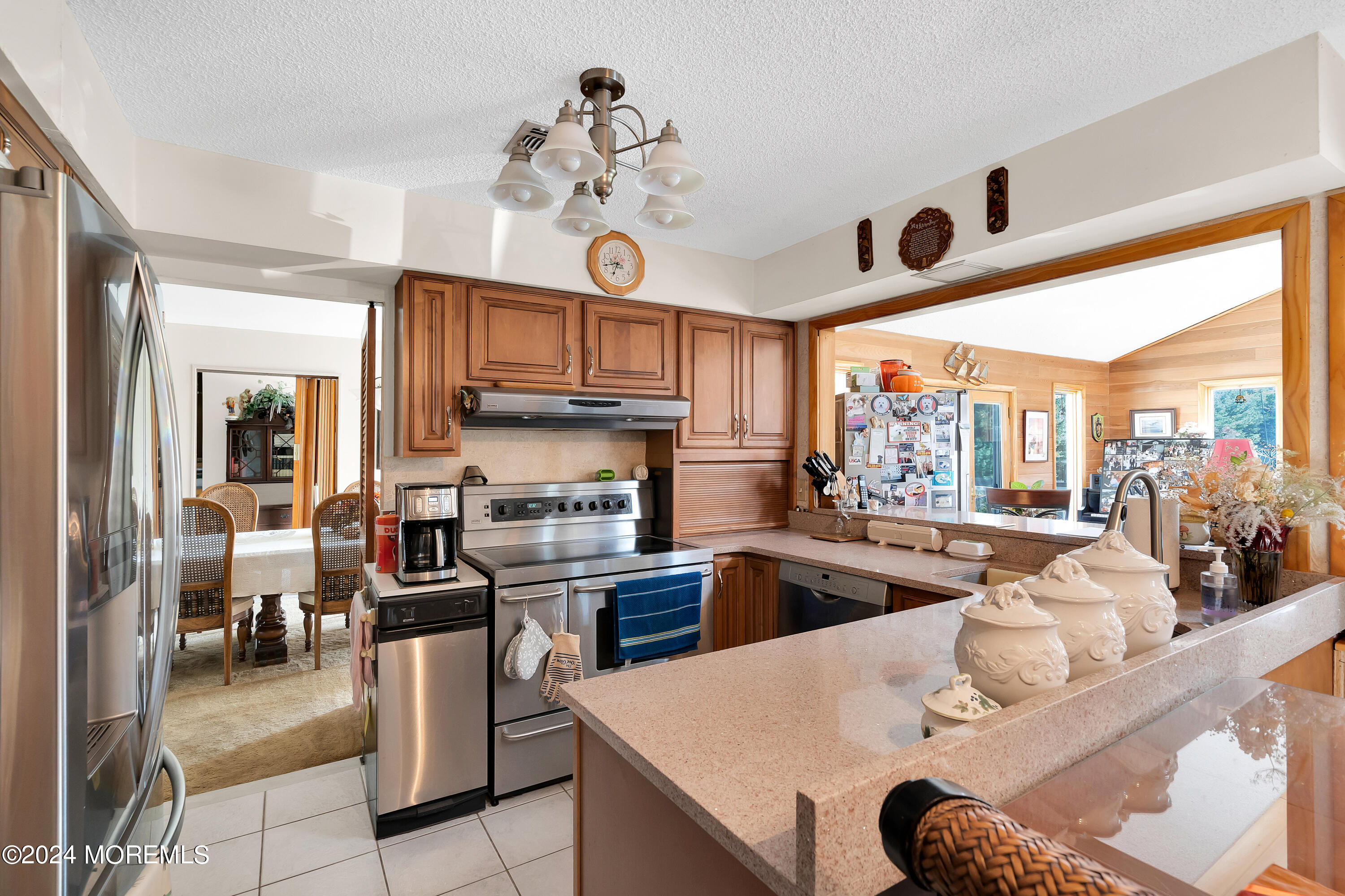 1521 Silverton Road Toms River, NJ 08755 - Photo 11 of 59 a large kitchen with a table and chairs