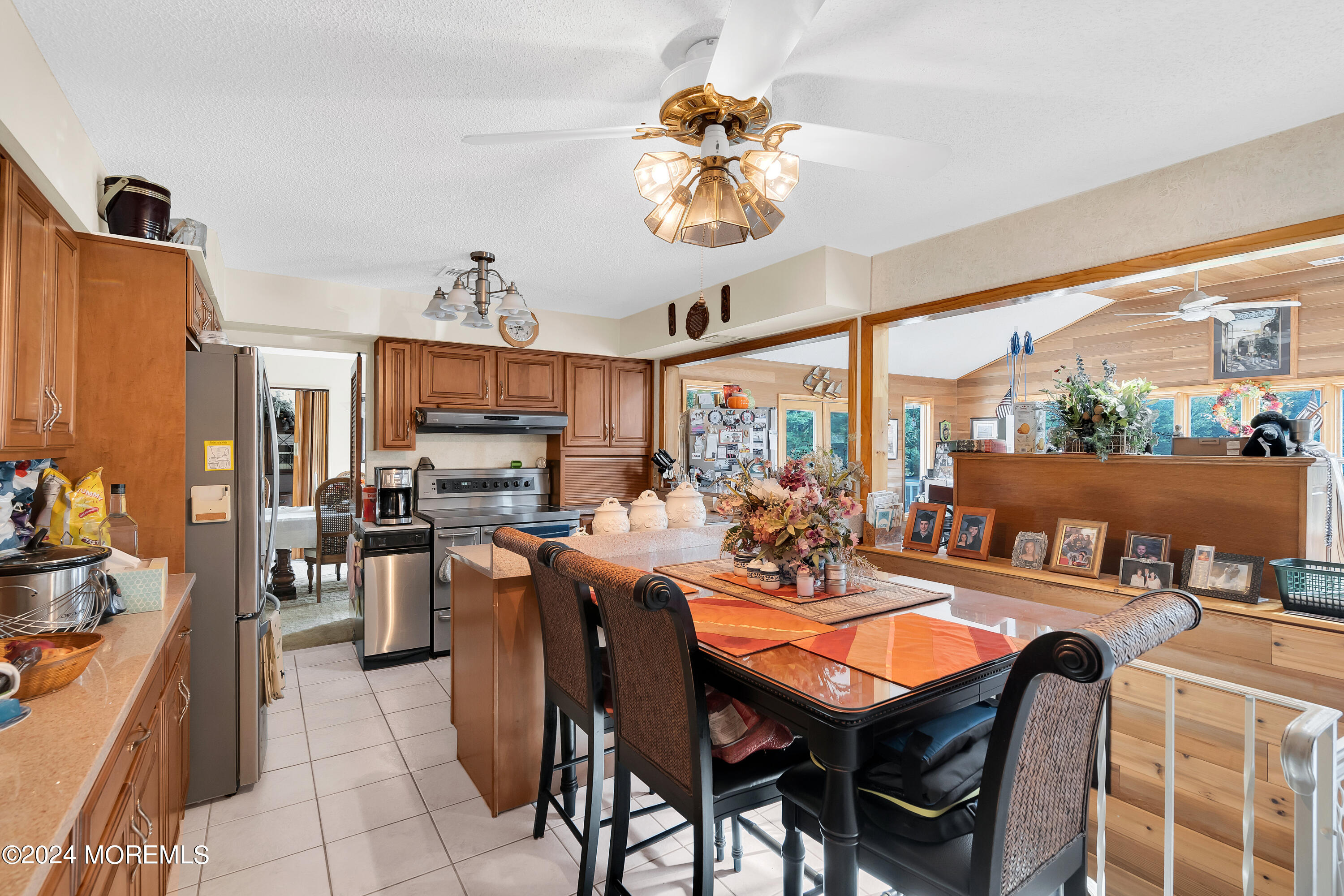 1521 Silverton Road Toms River, NJ 08755 - Photo 14 of 59 a large kitchen with a table and chairs