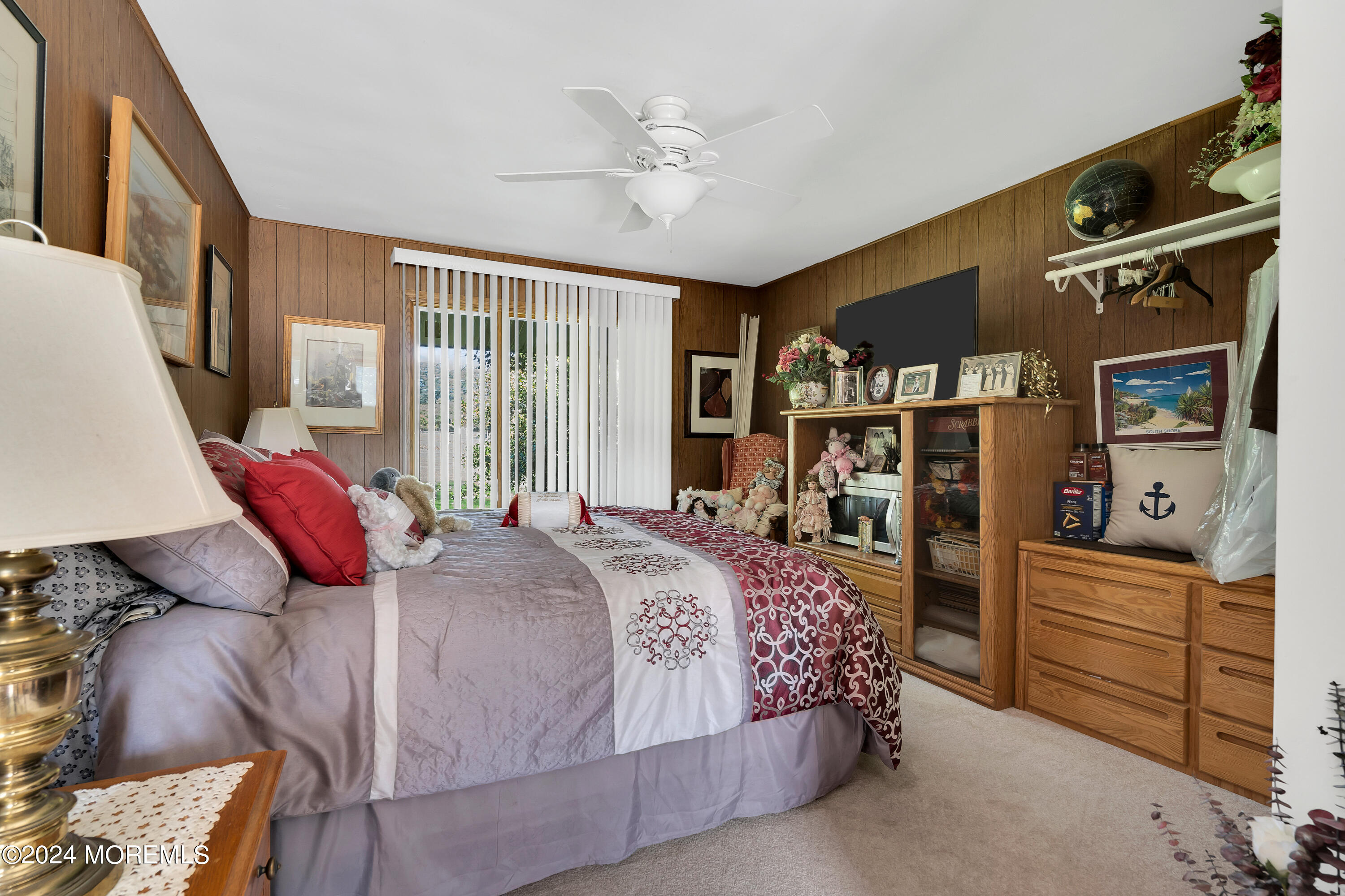 1521 Silverton Road Toms River, NJ 08755 - Photo 23 of 59 a bedroom with a bed and a chandelier