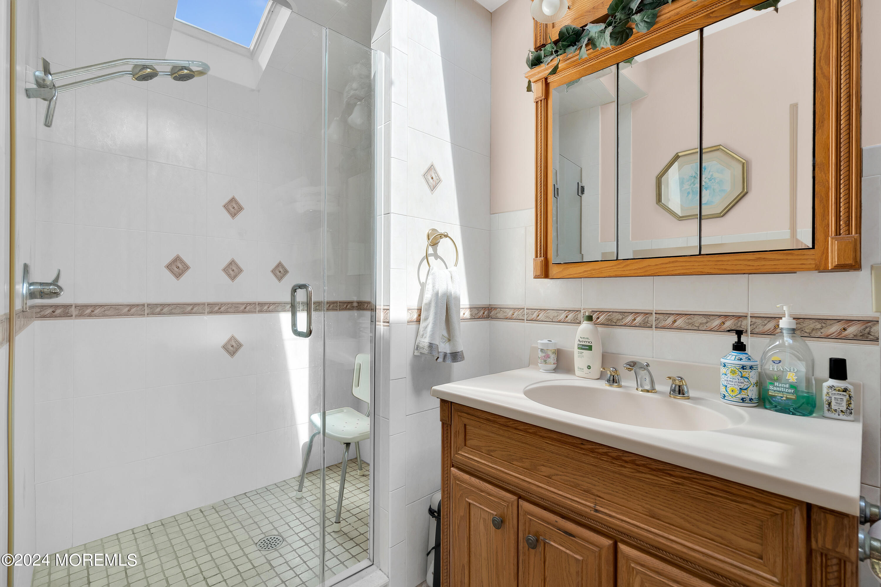 1521 Silverton Road Toms River, NJ 08755 - Photo 24 of 59 a bathroom with a sink and a mirror