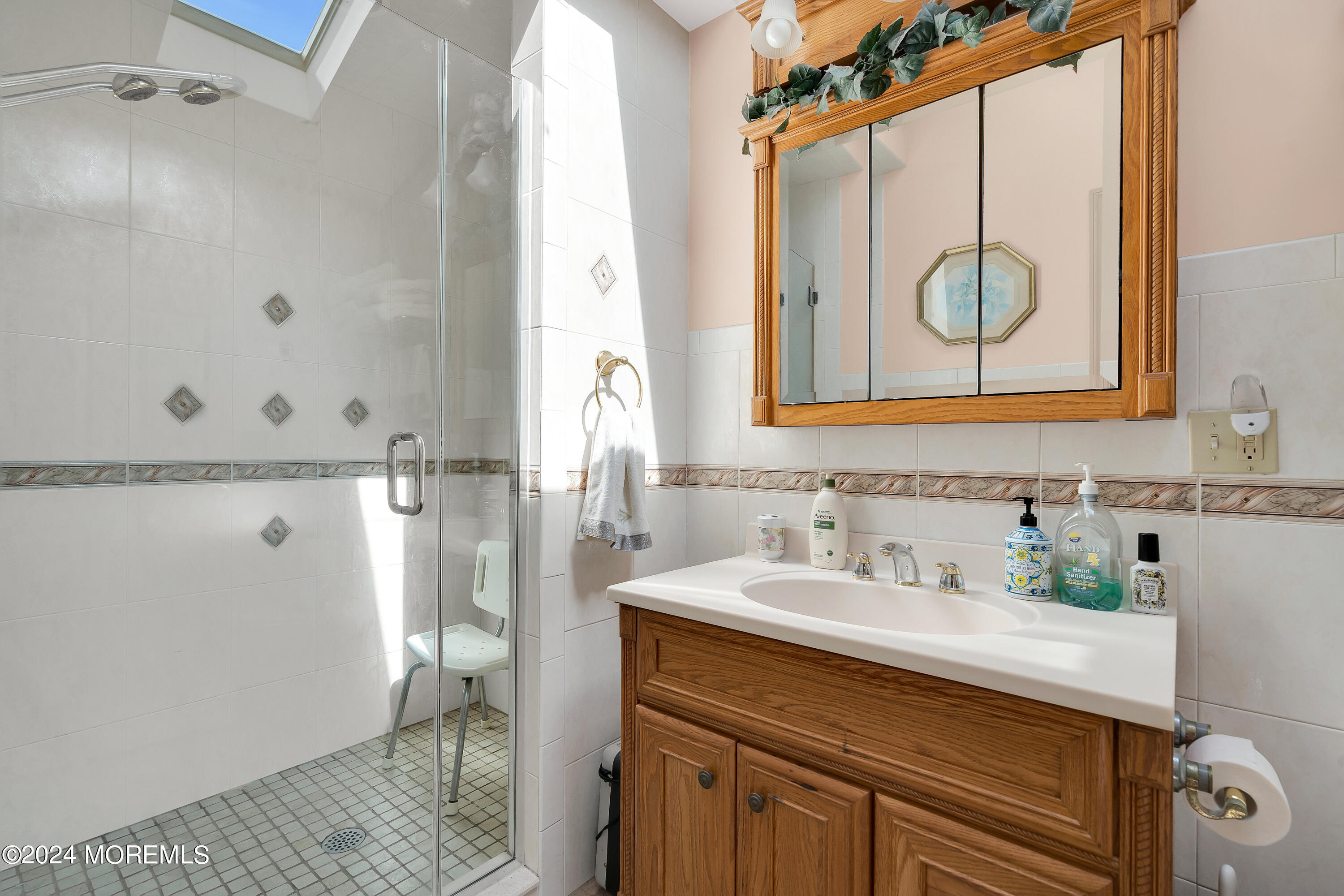 1521 Silverton Road Toms River, NJ 08755 - Photo 25 of 59 a bathroom with a sink and a mirror