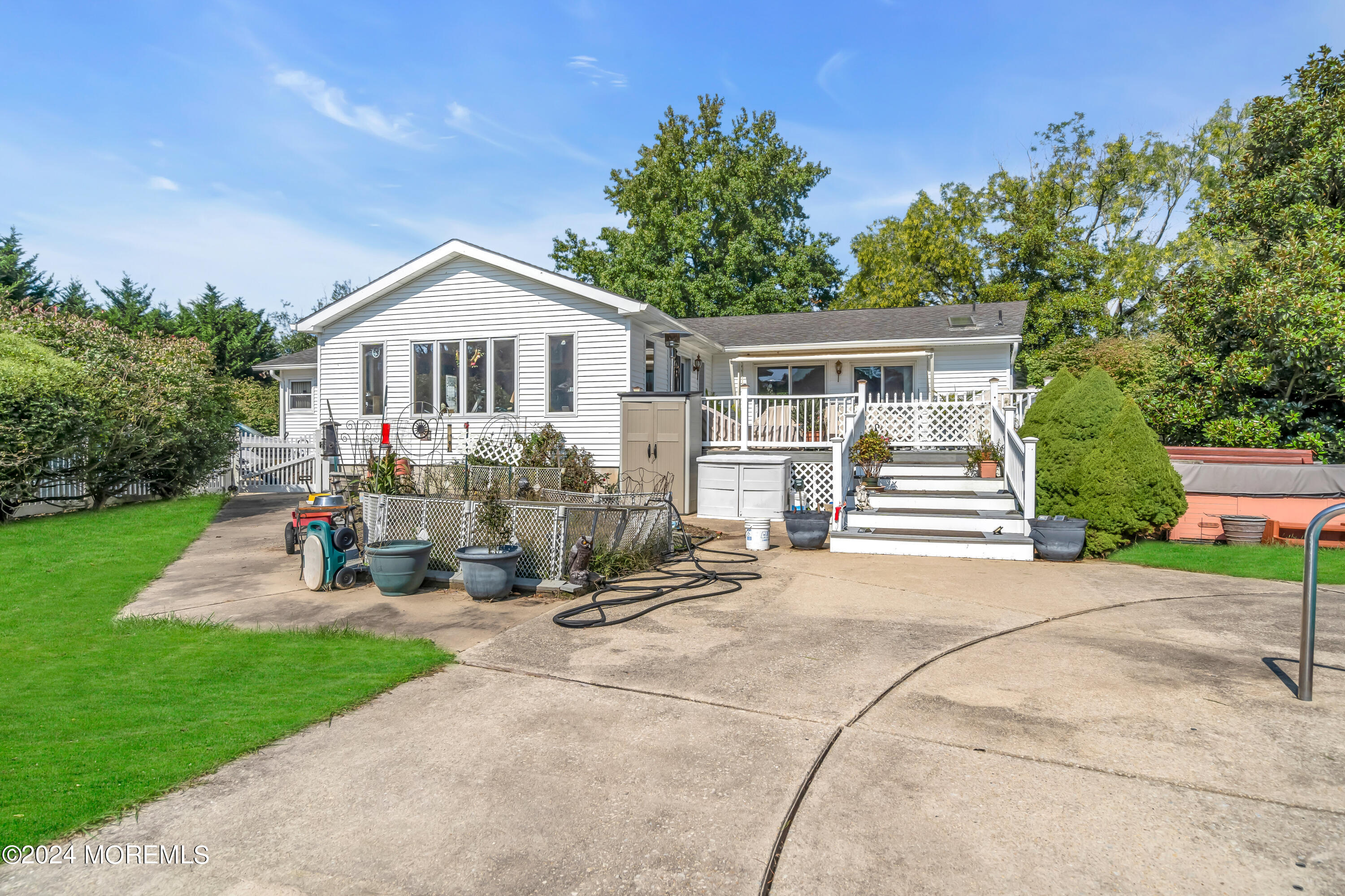 1521 Silverton Road Toms River, NJ 08755 - Photo 32 of 59 a view of a house with sitting area and garden