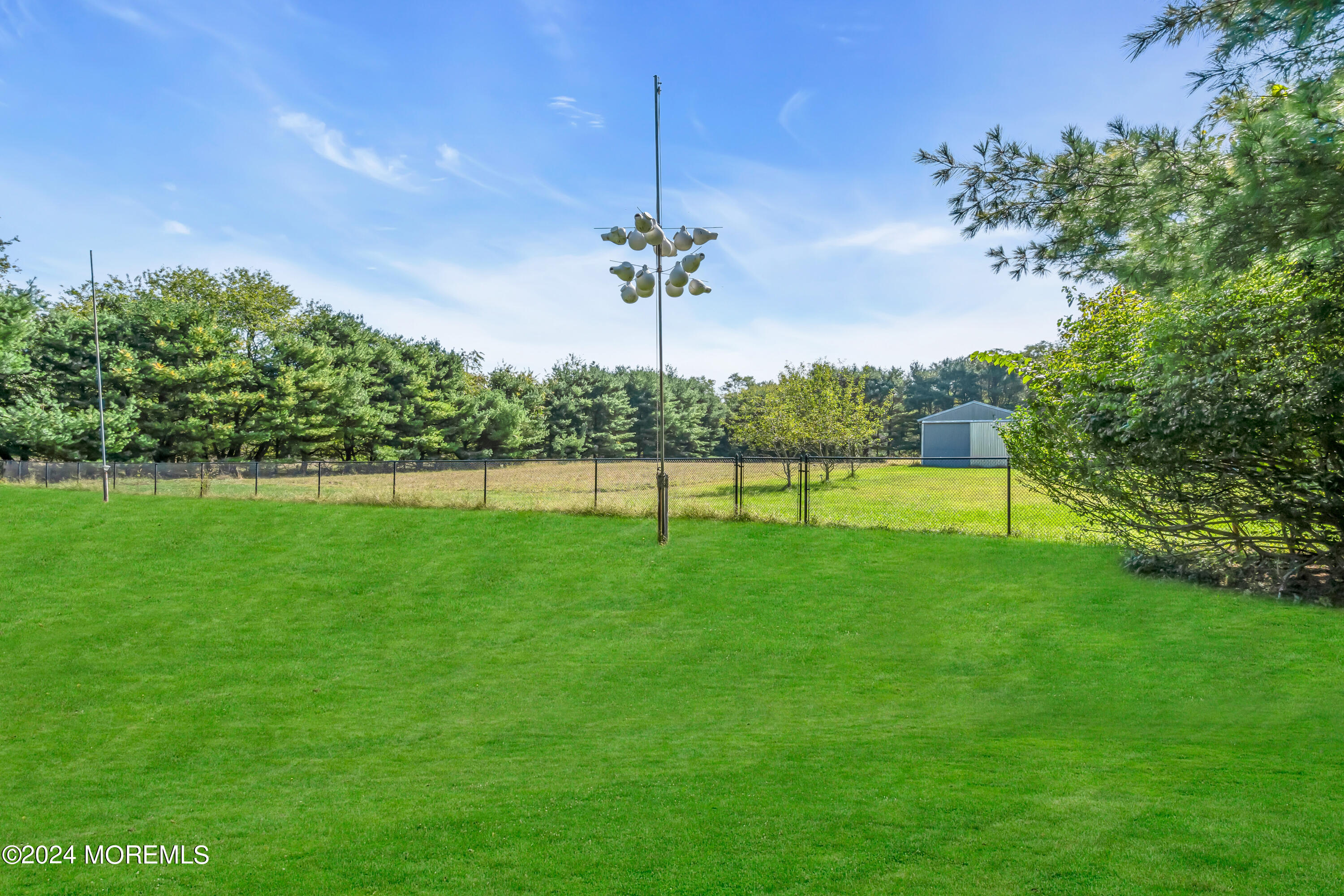 1521 Silverton Road Toms River, NJ 08755 - Photo 34 of 59 a view of a park with a tree in the background