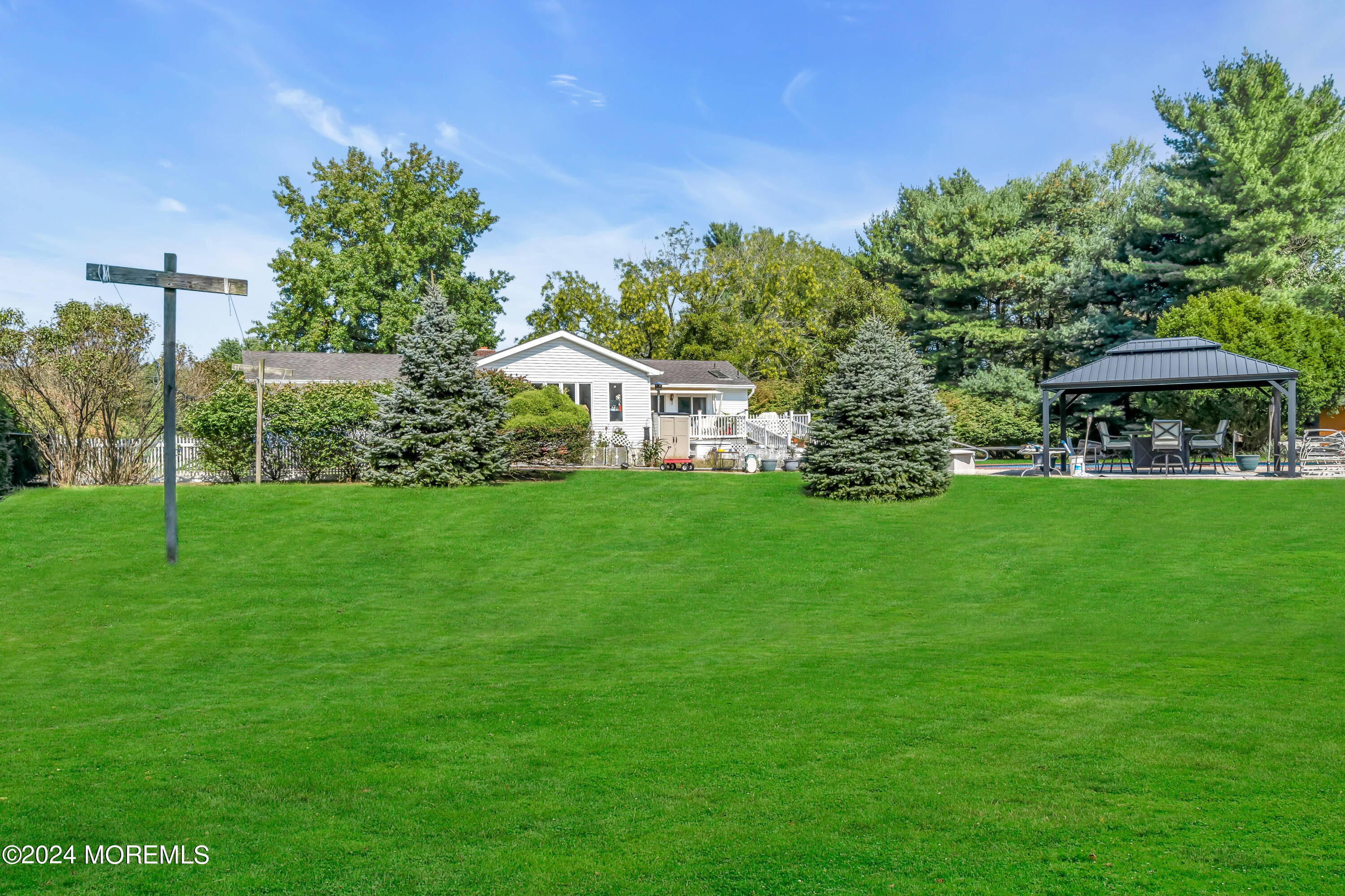 1521 Silverton Road Toms River, NJ 08755 - Photo 36 of 59 a front view of a house with garden
