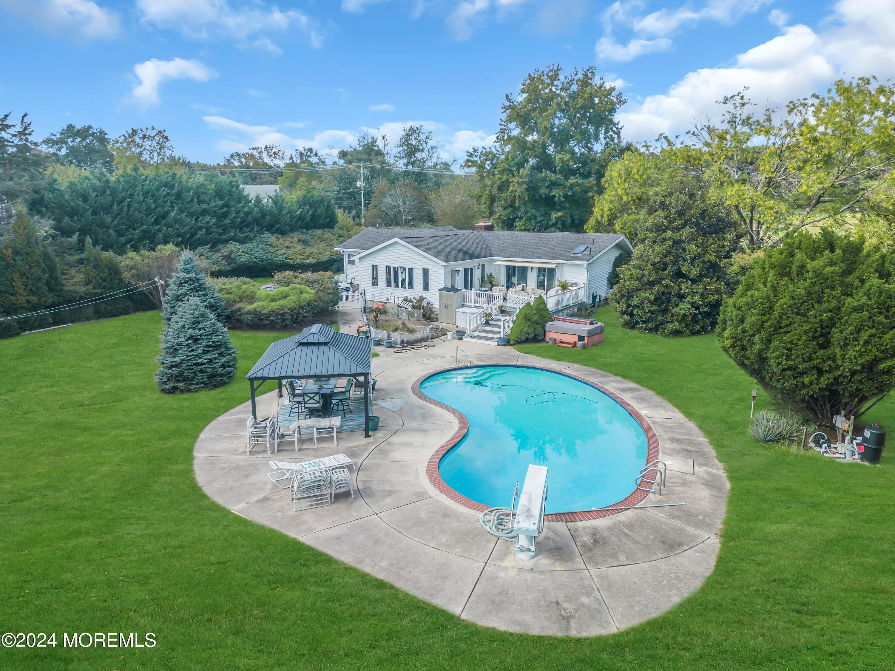 1521 Silverton Road Toms River, NJ 08755 - Photo 38 of 59 a view of a house with a backyard porch and sitting area