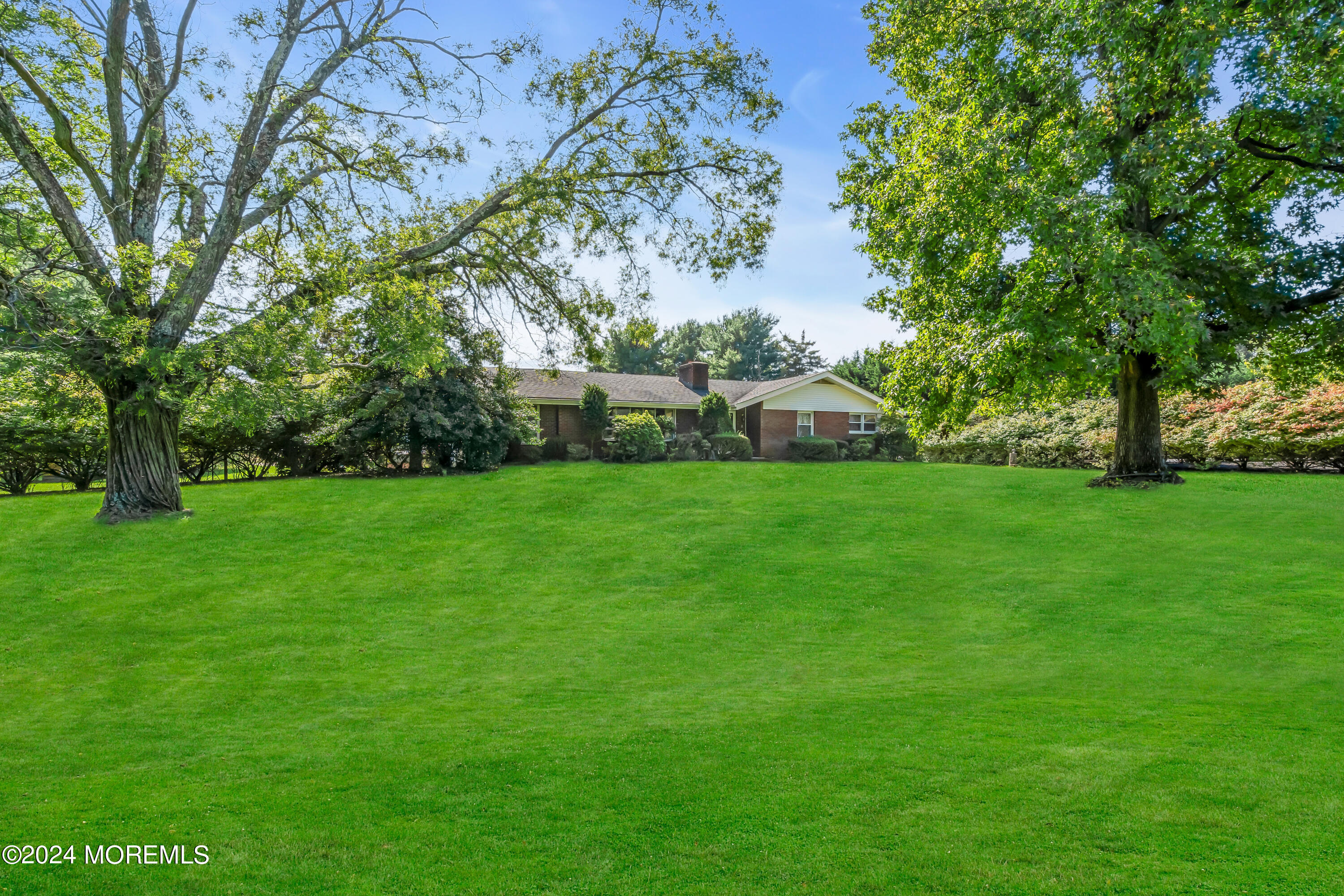 1521 Silverton Road Toms River, NJ 08755 - Photo 4 of 59 a view of a house next to a big yard and large trees